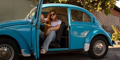Woman Wearing White Shirt Sitting Inside Blue Volkswagen ...