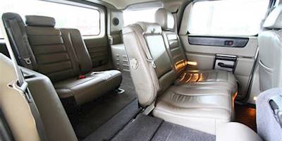 2004 Hummer H2 Rear | With one seat folded for access to ...